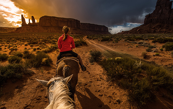 Woman on horseback riding in Southwest