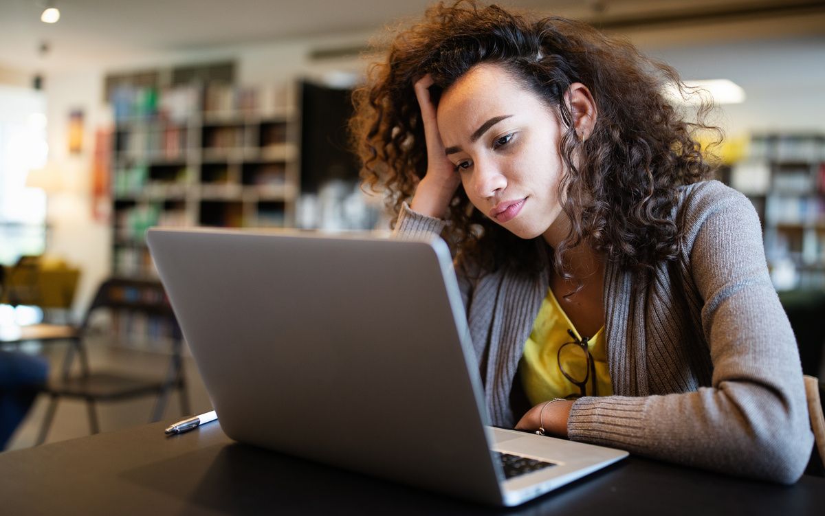 Woman with ADHD looking at computer.