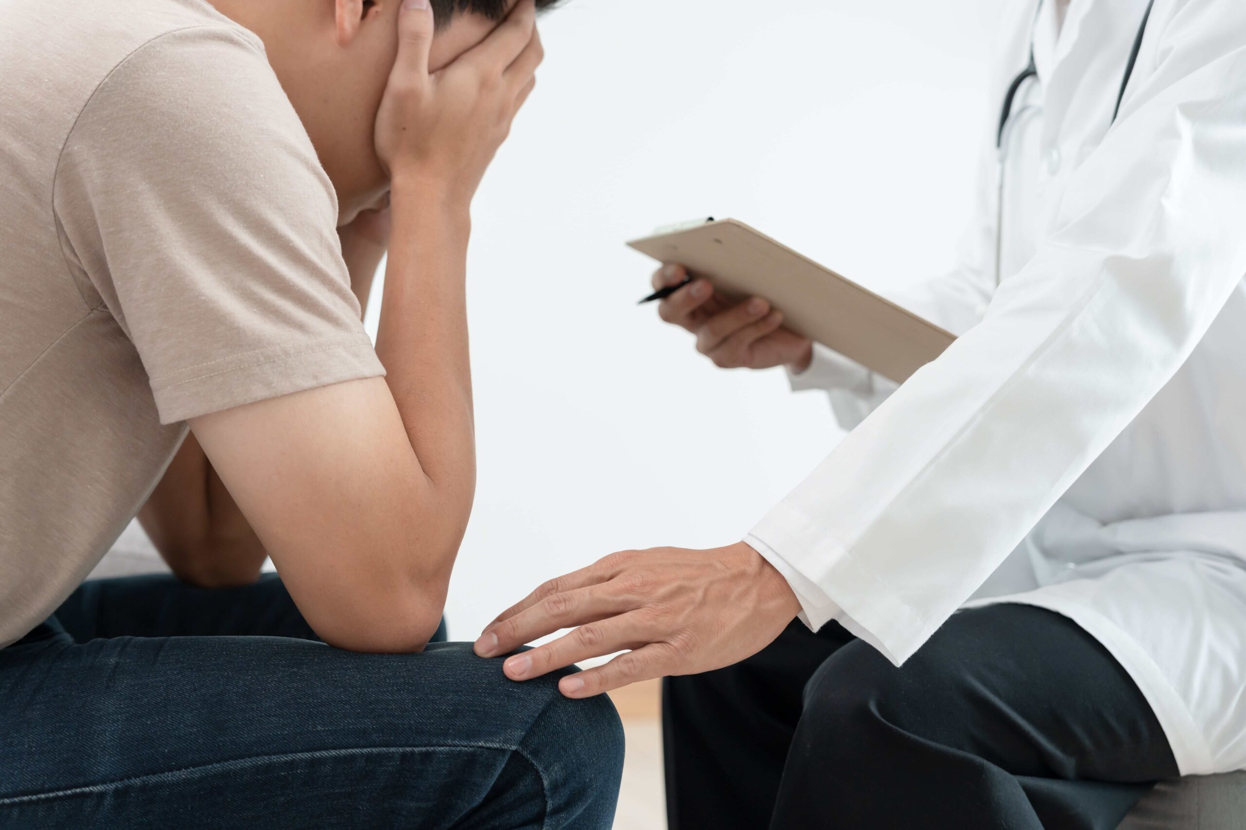 depressed patient with bipolar disorder speaking with a doctor